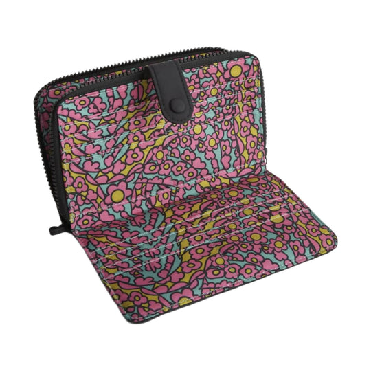 Floral zip-around wallet with snap tab closure, quilted panels, and black trim