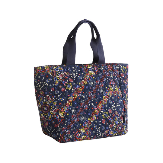 Navy quilted tote bag with colorful paisley and star pattern and black handles