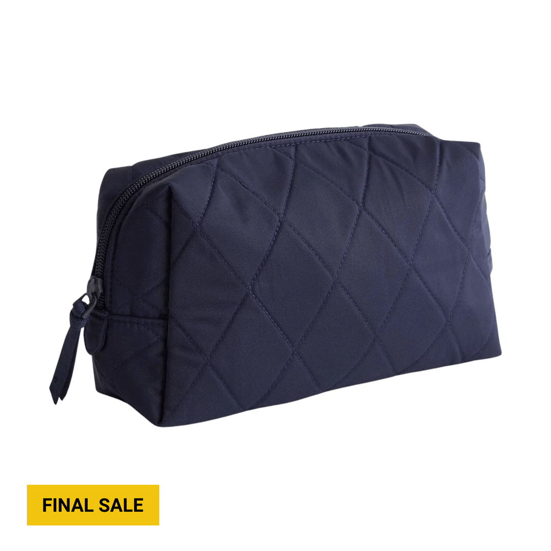 Navy quilted zip cosmetic bag with side tassel pull