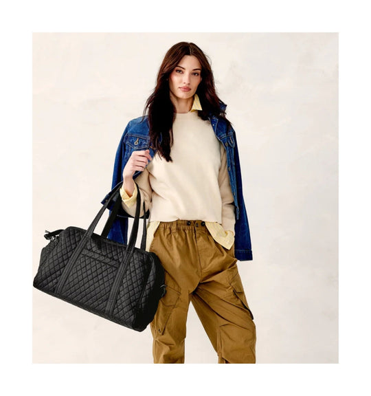 Black quilted weekender duffel bag with long shoulder straps