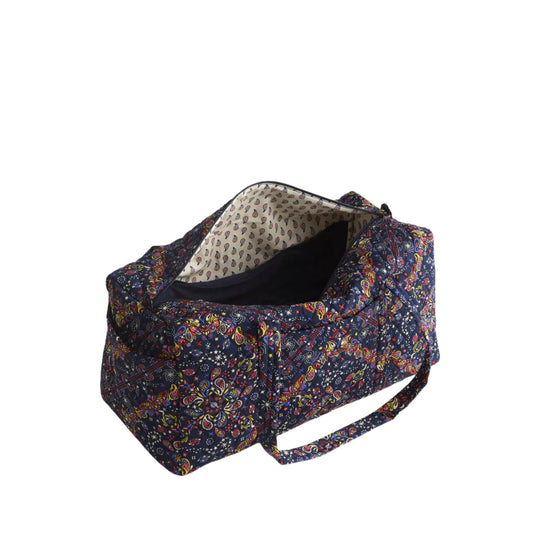 Navy patterned duffel bag with side handles and open top