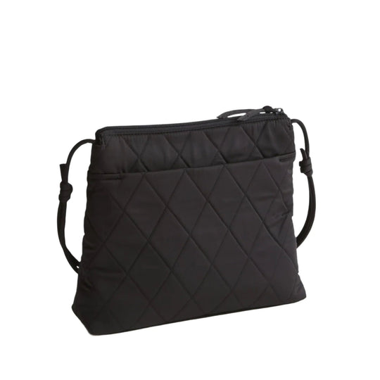 Black quilted zip-top crossbody bag with adjustable strap
