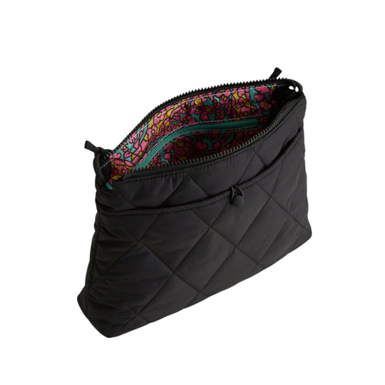 Black quilted zip pouch with a colorful floral lining and teal interior zipper pocket