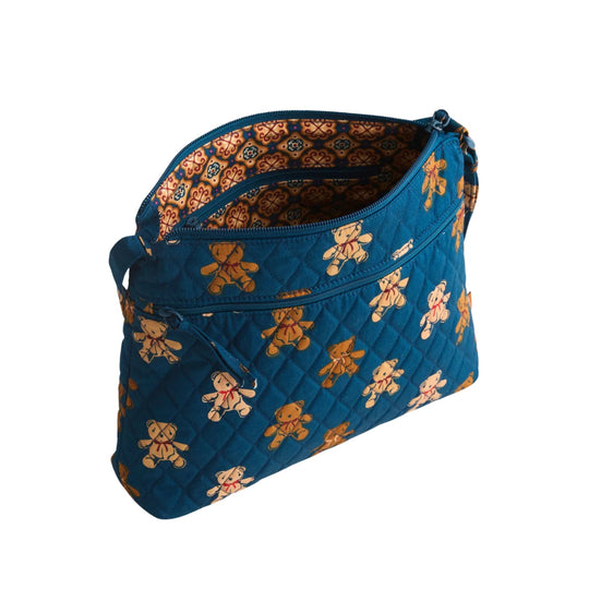 Blue quilted zip hipster bag with teddy bear print and patterned lining