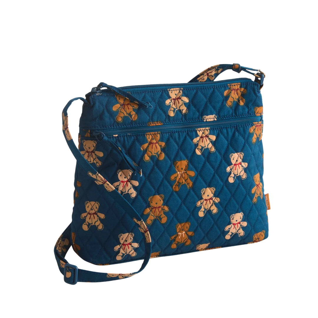 Blue quilted crossbody bag with teddy bear print and front zip pocket