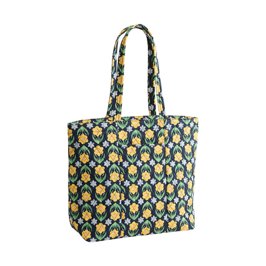 Quilted navy tote bag with yellow and green floral pattern and long shoulder straps