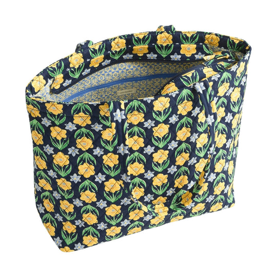 Navy quilted tote bag with yellow and green floral print and zippered opening