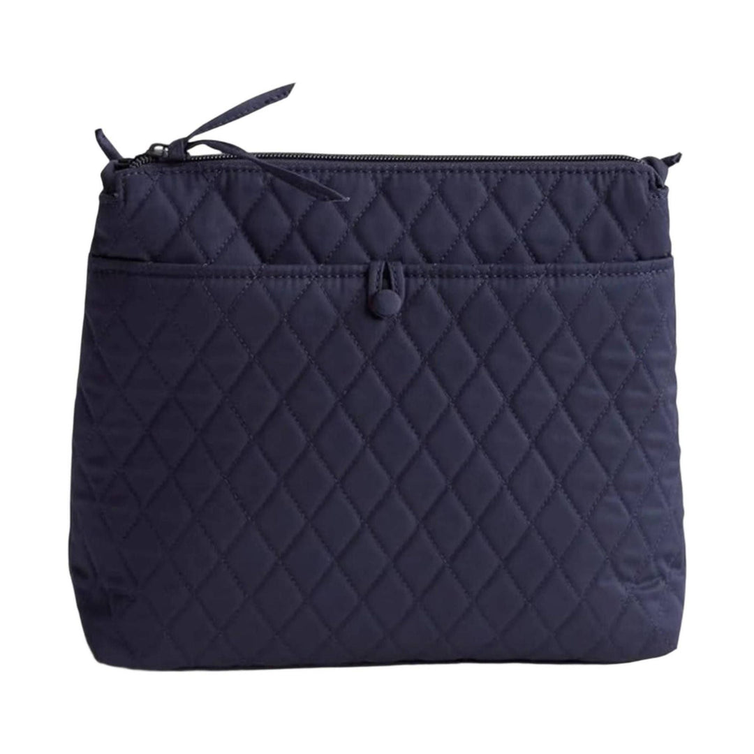 Navy quilted zip pouch with a front snap pocket