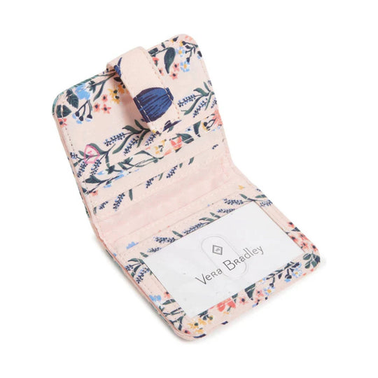 Floral-patterned tri-fold small wallet with card slots and a clear ID window