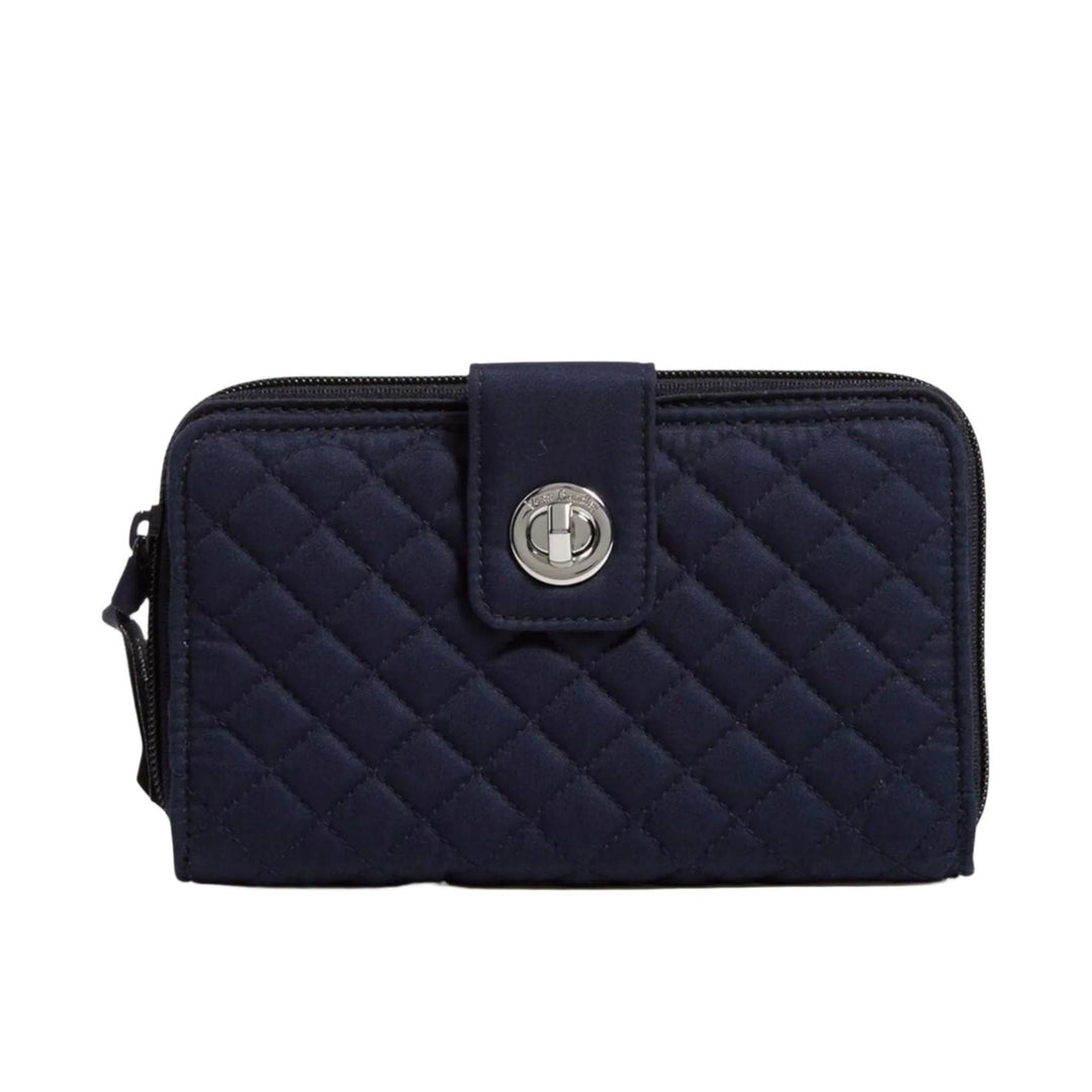 Navy quilted zip-around wallet with a front turnlock closure