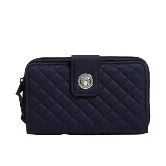Navy quilted zip-around wallet with a front turnlock closure