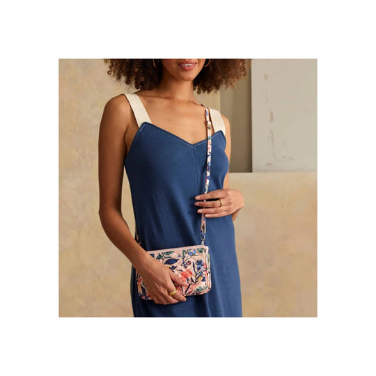 Blue crossbody dress with white straps and a small floral wallet purse
