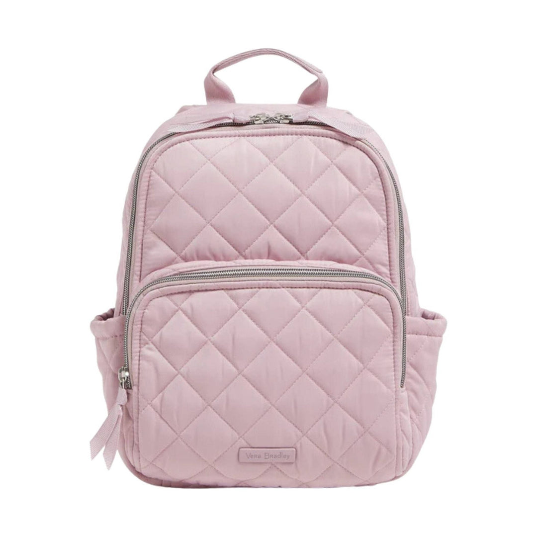 Light pink quilted backpack with front zip pocket and side bottle pockets