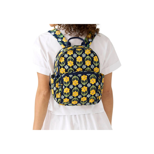 Floral print backpack with front zip pocket, side pockets, and top handle