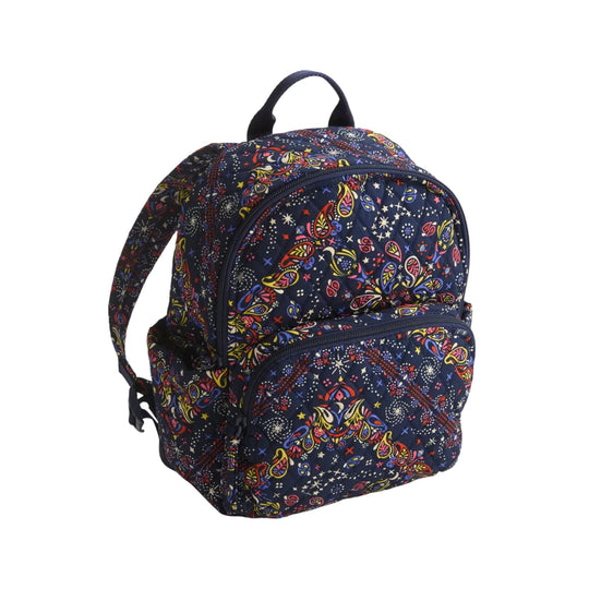 Small navy backpack with colorful paisley and star print, front zip pocket, and top handle