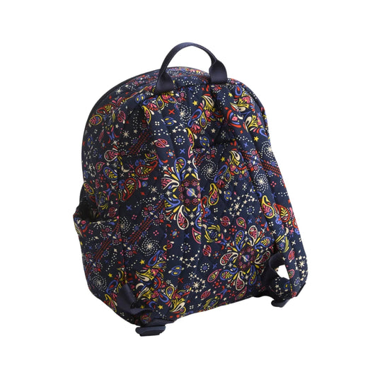 Small navy backpack with a colorful floral and star print, top handle, and padded straps
