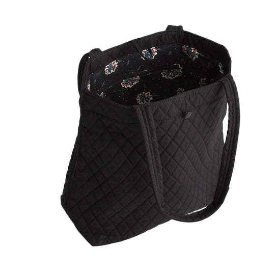 Black quilted tote bag with patterned lining and long shoulder straps