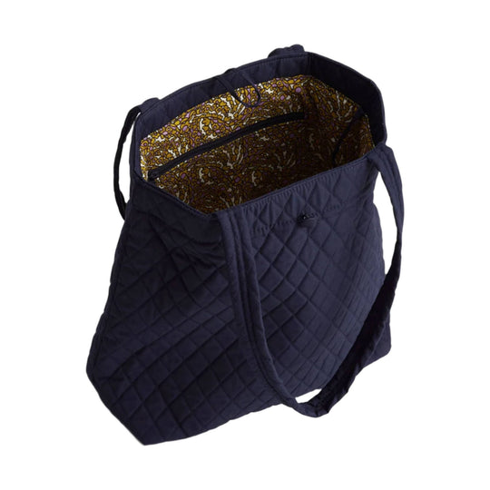Quilted navy tote bag with open top, shoulder straps, and patterned interior lining