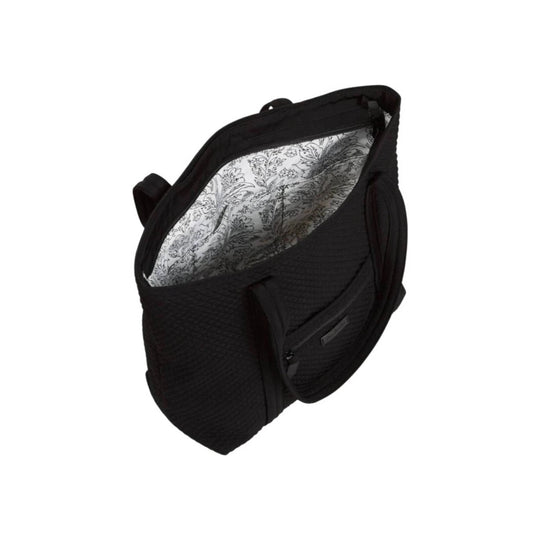 Black quilted tote bag with floral-patterned lining and front zip pocket