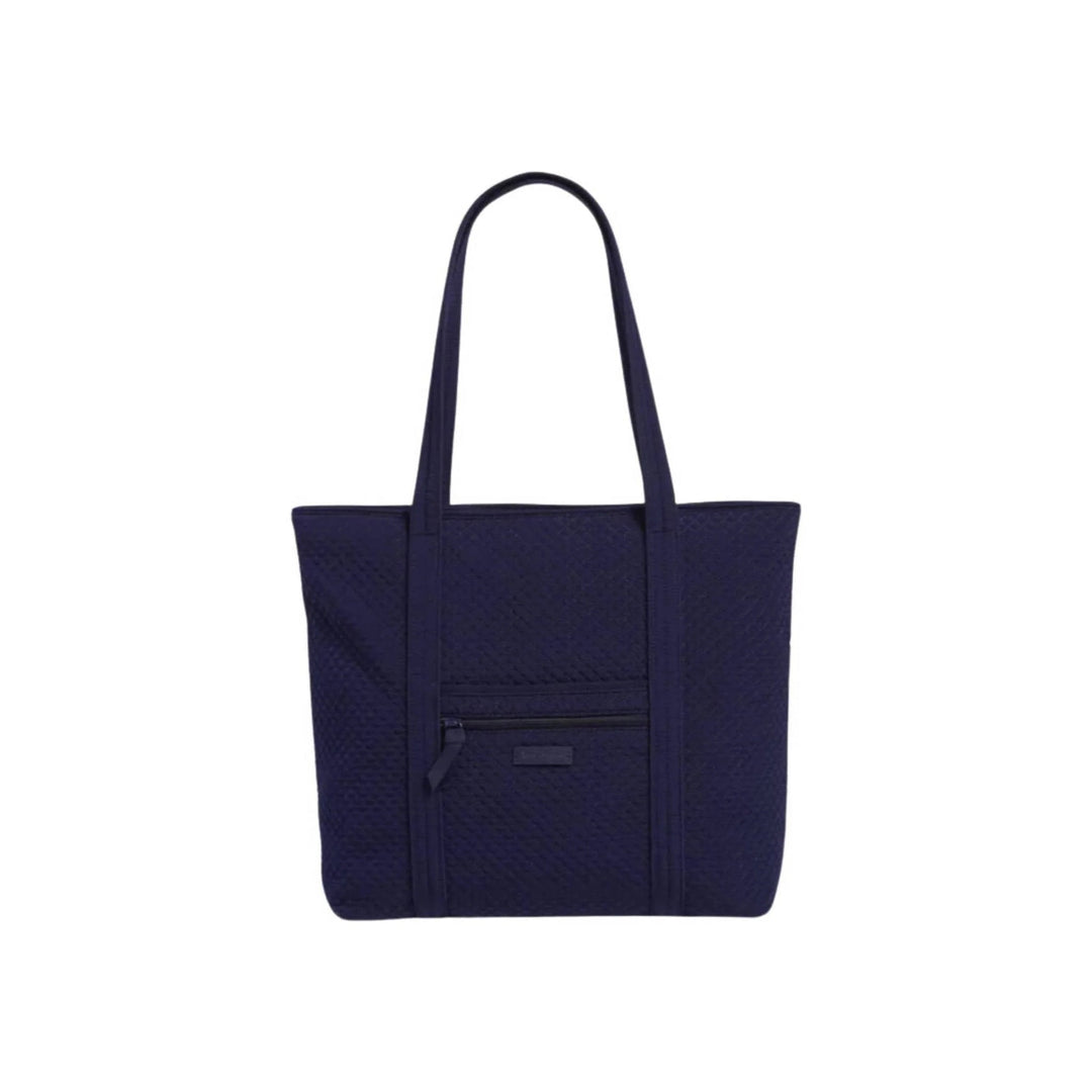 Dark navy quilted tote bag with long shoulder straps and a front zip pocket