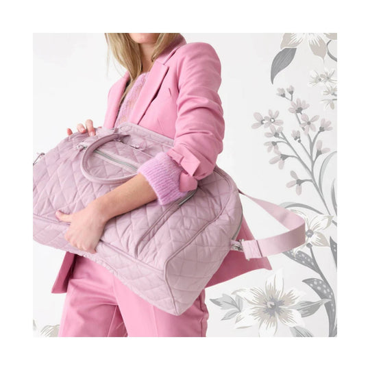 Light pink quilted weekender bag with zipper pocket and shoulder strap