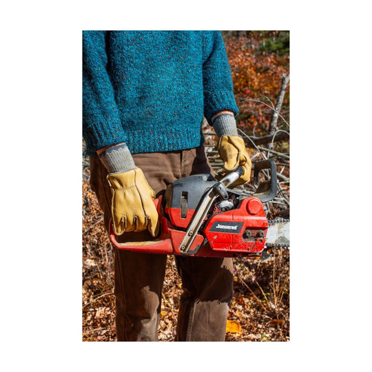 Tan leather work gloves holding a red chainsaw