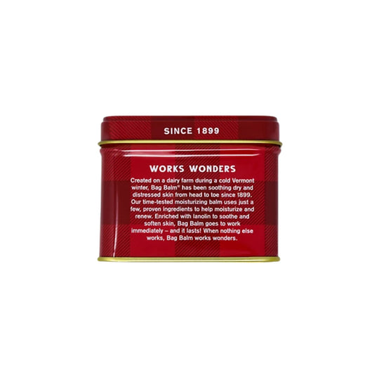 Red metal balm tin with gold lid trim and white text reading “WORKS WONDERS” and “SINCE 1899”