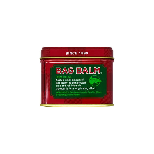 Red metal tin of Bag Balm with green label and gold lid, showing “SINCE 1899”