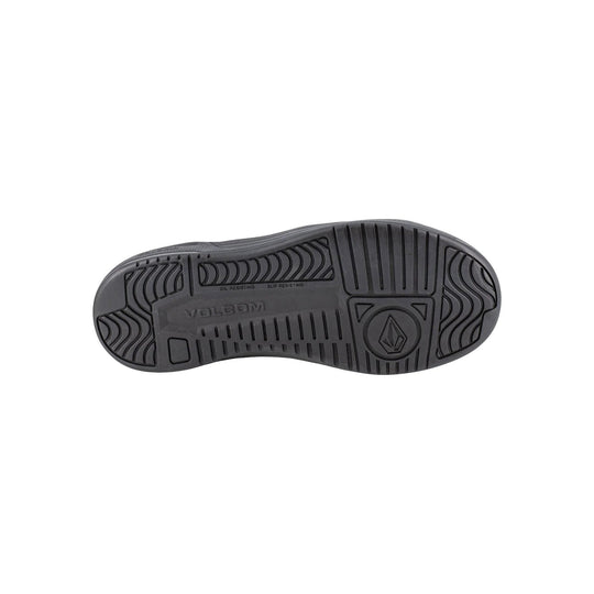 Black work shoe outsole with traction grooves and Volcom branding