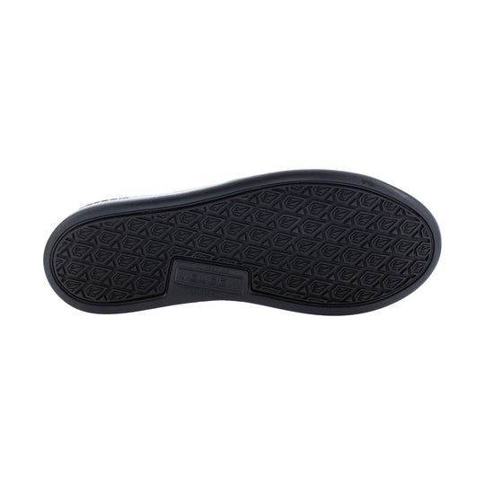 Black shoe outsole with geometric tread and VOLCOM logo