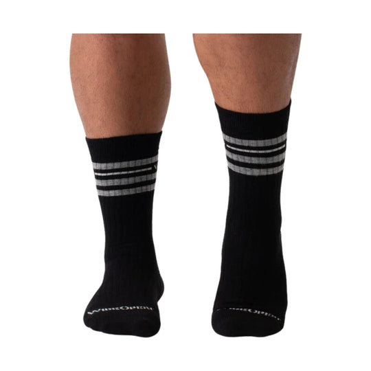 Black crew socks with gray and white horizontal stripes near the calf, shown on both legs