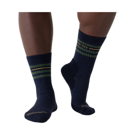 Pair of navy crew socks with green and yellow horizontal stripes and small logo text