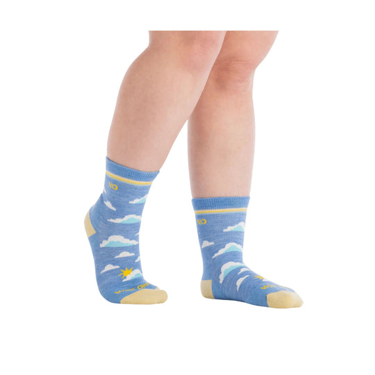 Blue mid-calf socks with cloud pattern, yellow toe and heel accents, worn on a model's legs