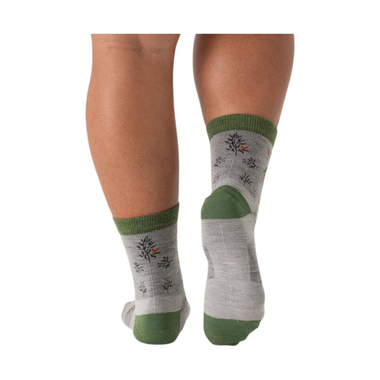 Gray ankle socks with green cuffs, heels, and toes shown on legs from the back