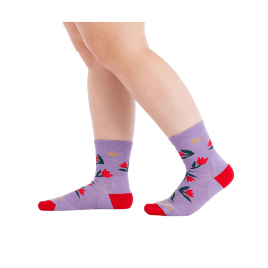 Lavender crew socks with red toe and heel, floral print, shown on crossed legs