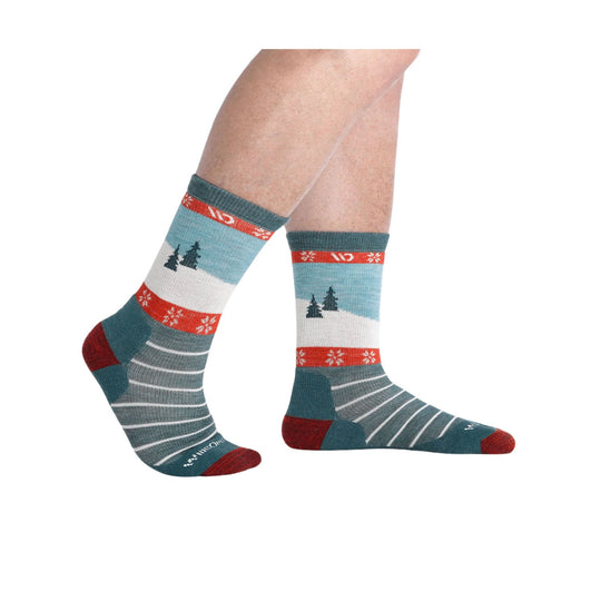 Teal crew socks with red accents, snowflake bands, trees, and white striped details