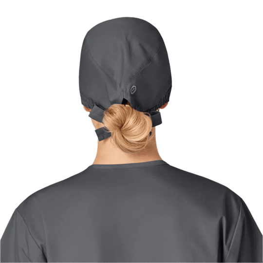 Dark gray scrub cap shown from the back with tie straps and a low bun opening