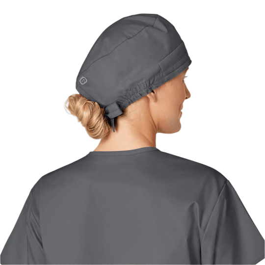 Gray scrub cap shown from the back on a person with hair in a bun