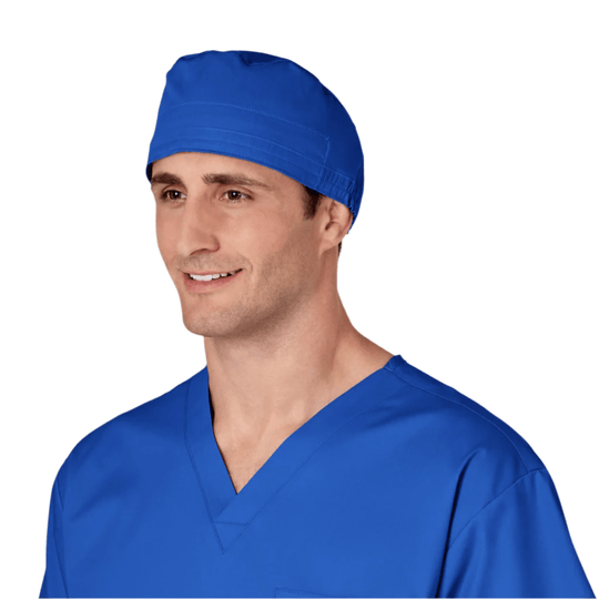 Blue scrub cap worn with a matching blue V-neck scrub top on a model