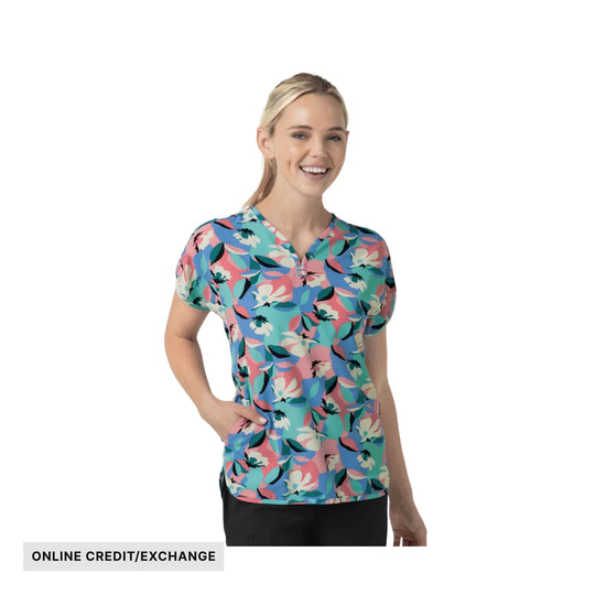 Floral scrub top on a model with ONLINE CREDIT/EXCHANGE text