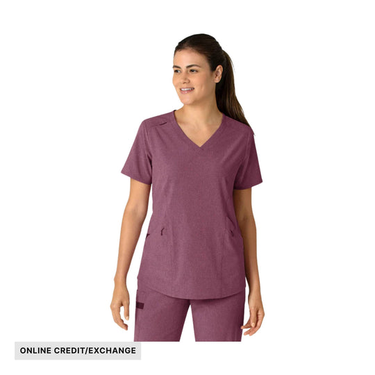 Woman wearing a heathered burgundy V-neck scrub top and pants with pockets; “ONLINE CREDIT/EXCHANGE” label