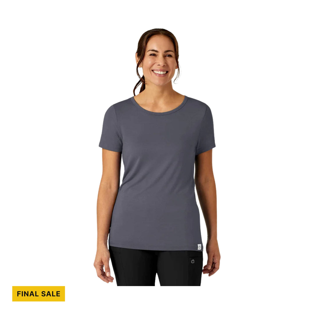 Woman wearing a charcoal short-sleeve crewneck tee with a FINAL SALE label
