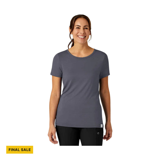 Woman wearing a charcoal short-sleeve crewneck tee with a FINAL SALE label