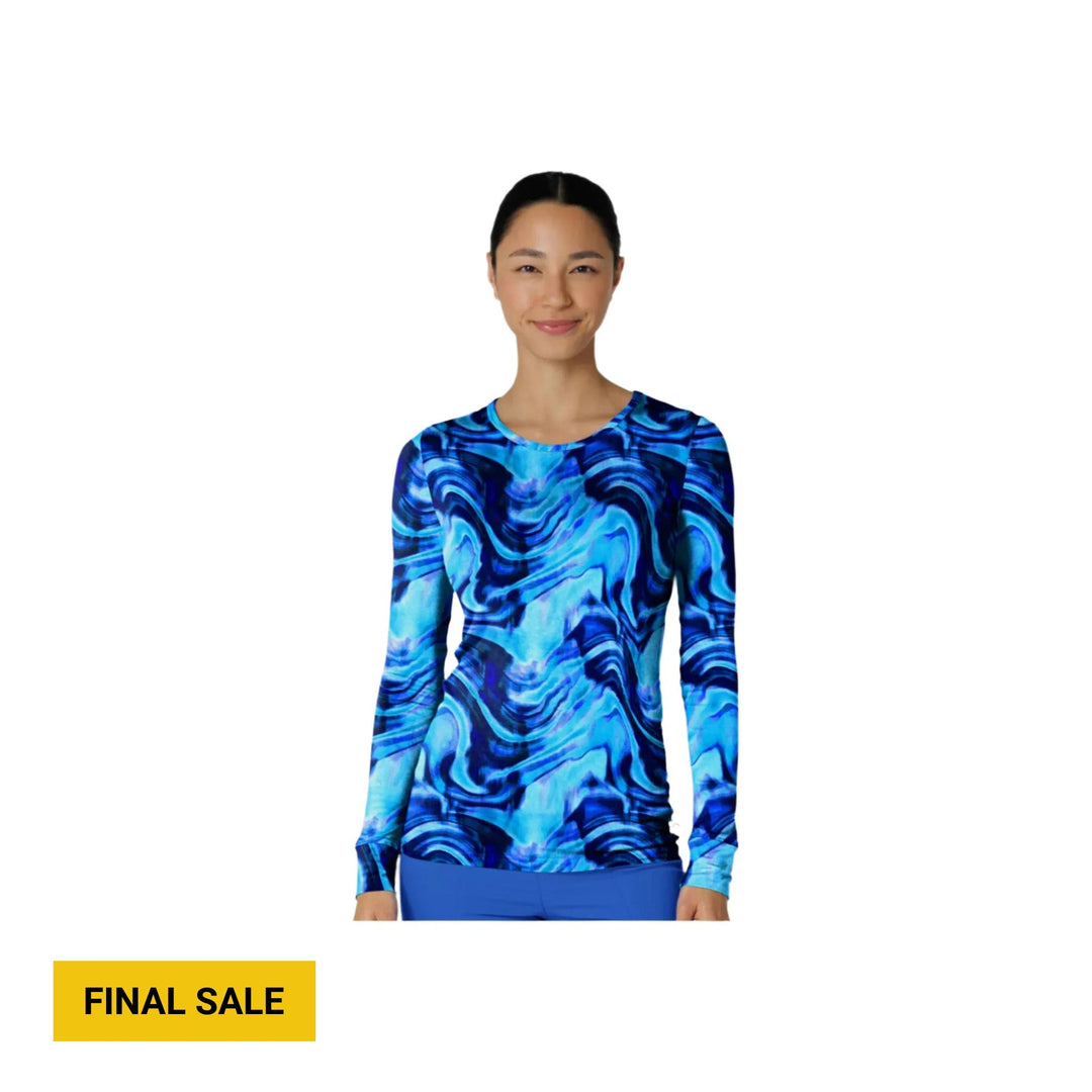 Woman modeling a blue abstract long-sleeve scrub tee with a crew neck