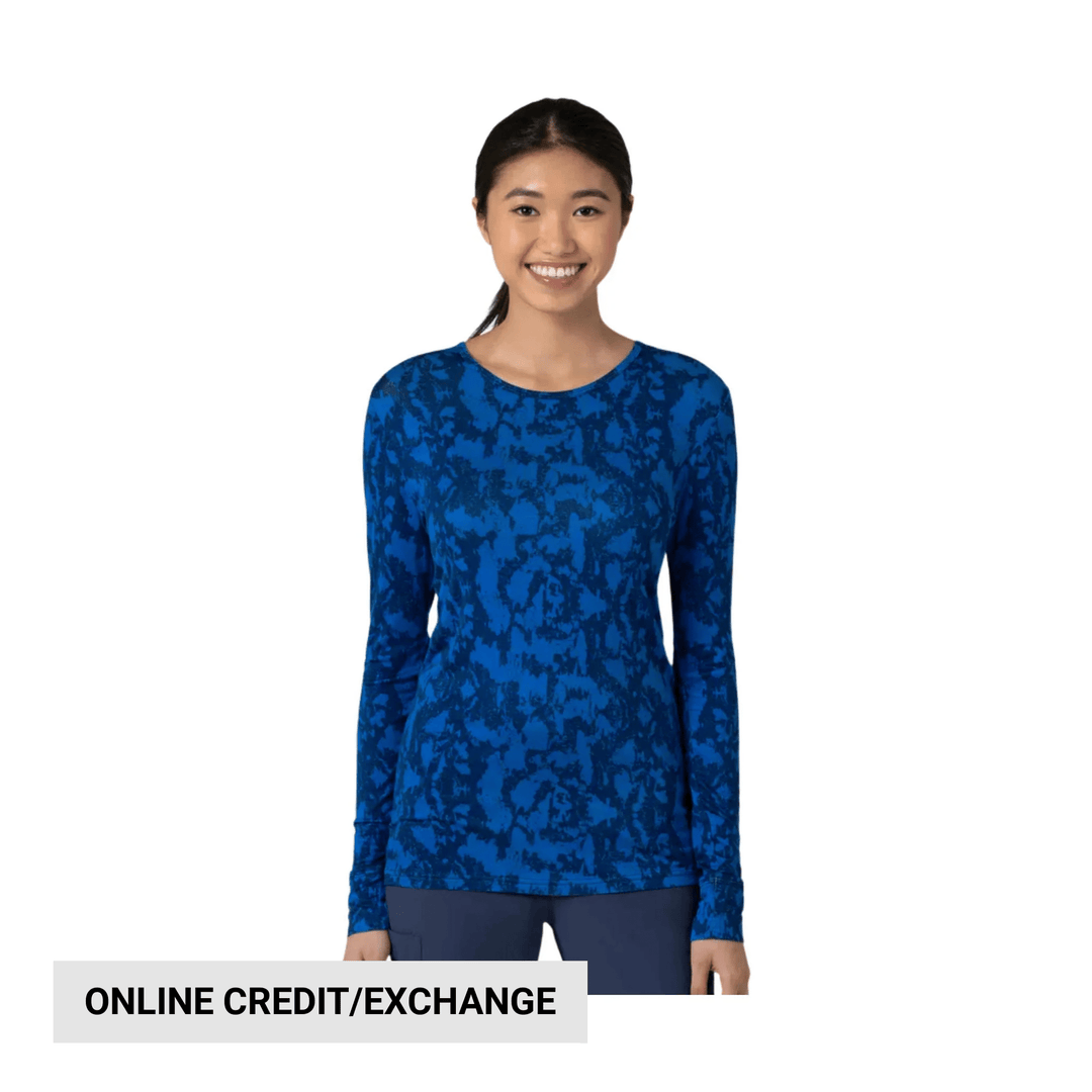 Long-sleeve blue patterned scrub top with a crew neck and fitted silhouette; visible text reads "ONLINE CREDIT/EXCHANGE"