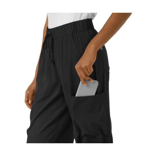 Black wide-leg scrub pants with elastic waist, drawstring, and large side pocket.