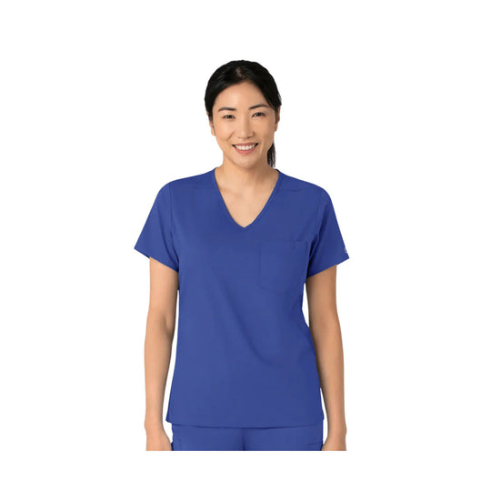 Woman wearing a blue V-neck scrub top with short sleeves and a chest pocket