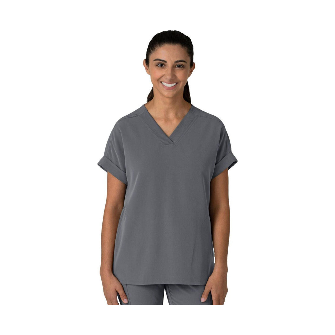 Gray scrub top with V-neck and short rolled sleeves on a model