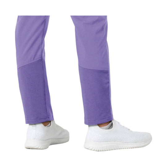Lavender scrub pants with ribbed lower legs and white slip-on sneakers