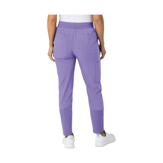 Lavender scrub pants shown from the back with cargo pockets and tapered legs